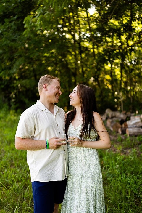 Groom to be proposing during surprise wedding proposal at family home | Emotional reaction during surprise wedding proposal at family home in Missouri | Couple celebrating after surprise wedding proposal at family home | Portraits of newly engaged couple after surprise wedding proposal