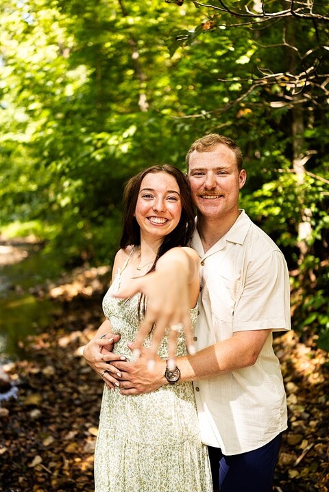 Groom to be proposing during surprise wedding proposal at family home | Emotional reaction during surprise wedding proposal at family home in Missouri | Couple celebrating after surprise wedding proposal at family home | Portraits of newly engaged couple after surprise wedding proposal