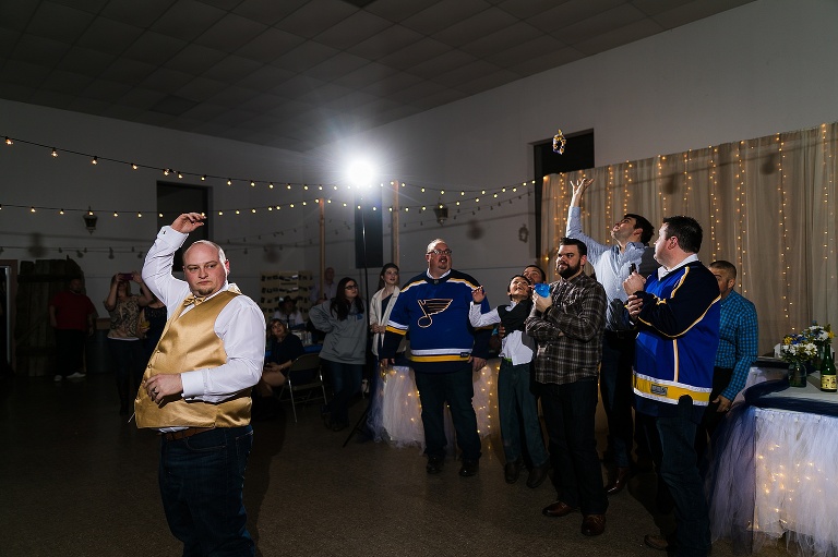 Pea Ridge Farms | St Charles Wedding Photographer | Warrenton Wedding Photographer | Spring Wedding | Herman Missouri | Warrenton MO | Blues Fans | Country wedding | Rustic | Boots and Lace | St Louis Blues | Hockey Fans | NHL | Hockey Sticks | Lets go Blues | Jonesburg Community Center | Jonesburg Community Hall | Jonesburg Missouri | Garter Toss