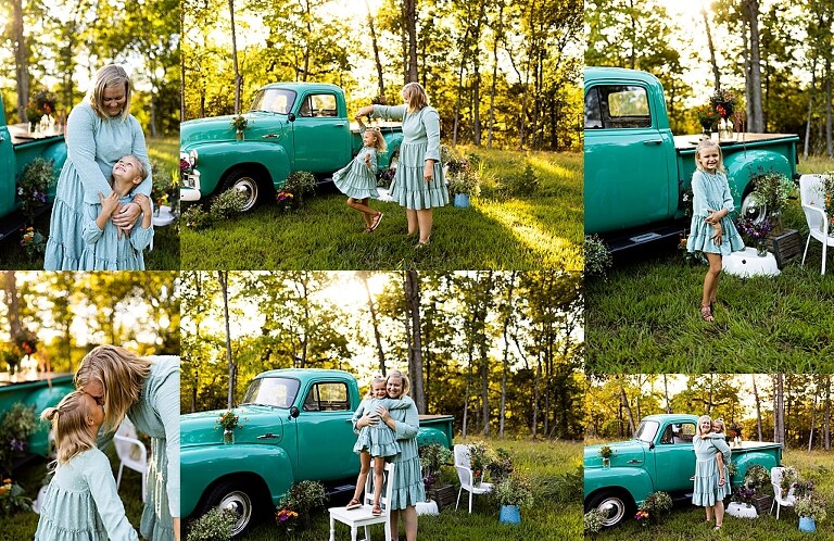 Mom and daughter smiling near a vintage teal truck and wildflowers during sunset in High Hill Missouri