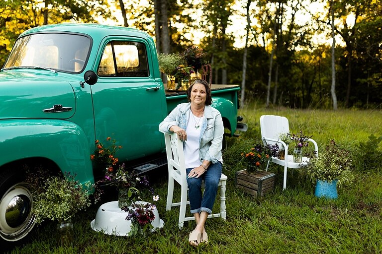 Family hugging with their mother during flower truck session in High Hill Missouri