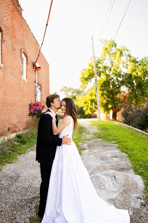 Bride and groom portraits at Heritage on Broadway Wedding Venue in Elsberry MO, historic wedding setup, vintage decor, Missouri wedding photographer