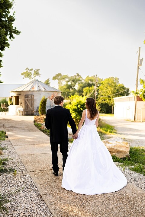 Bride and groom portraits at Heritage on Broadway Wedding Venue in Elsberry MO, historic wedding setup, vintage decor, Missouri wedding photographer