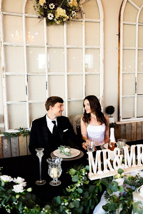 Bride and groom portraits at Heritage on Broadway Wedding Venue in Elsberry MO, historic wedding setup, vintage decor, Missouri wedding photographer