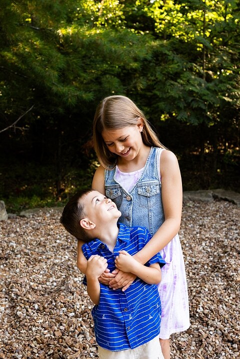 Extended family photos at Innsbrook Missouri with kids, grandparents, and parents celebrating an anniversary in summer heat.