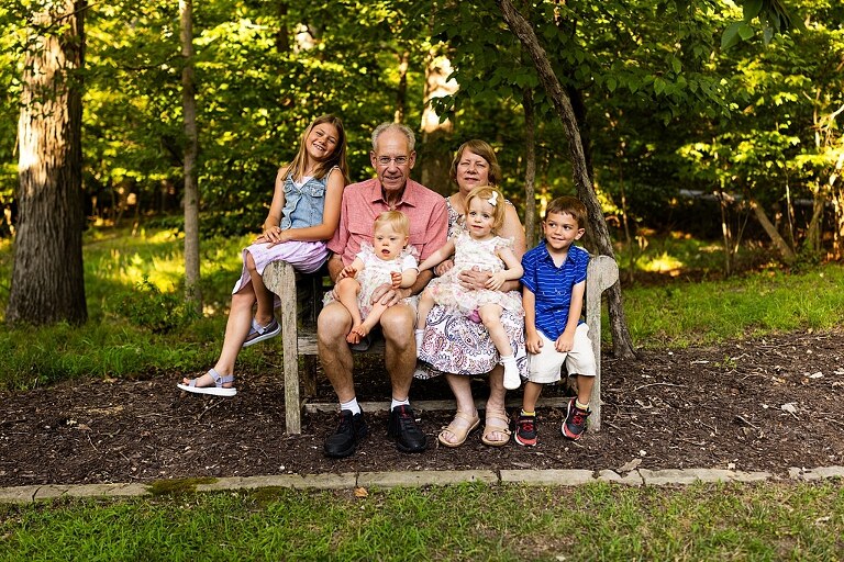 Extended family photos at Innsbrook Missouri with kids, grandparents, and parents celebrating an anniversary in summer heat.