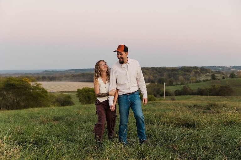 Family standing together in a warm country field during their 90’s style session.
Parents holding their kids with soft golden light behind them.
Family walking through a field during a country-inspired photo shoot.
Close-up of parents smiling during their session with Taylor Ligon Photography.
Kids laughing while standing between their parents in a sunny field.