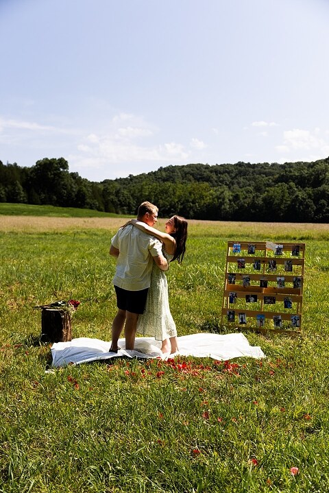 Groom to be proposing during surprise wedding proposal at family home | Emotional reaction during surprise wedding proposal at family home in Missouri | Couple celebrating after surprise wedding proposal at family home | Portraits of newly engaged couple after surprise wedding proposal