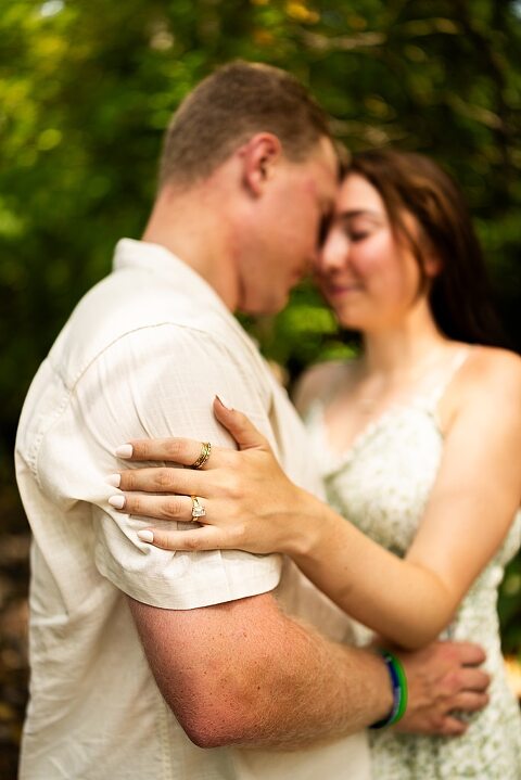 Groom to be proposing during surprise wedding proposal at family home | Emotional reaction during surprise wedding proposal at family home in Missouri | Couple celebrating after surprise wedding proposal at family home | Portraits of newly engaged couple after surprise wedding proposal