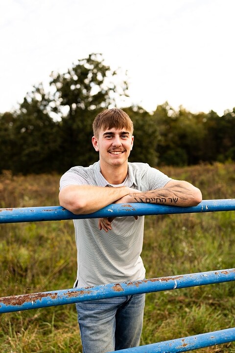 Twin senior boys from Warrenton High School standing on a gravel road in High Hill Missouri.
Brothers laughing together during their senior session in a country field.
Twin seniors leaning against a fence with warm evening light behind them.
Warrenton High School seniors walking side by side down a gravel path.
Close–up of the twins smiling during their High Hill Missouri session.