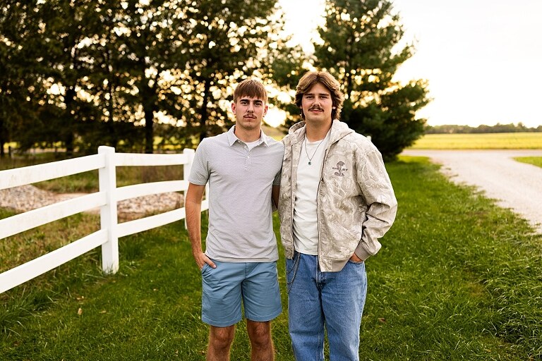 Twin senior boys from Warrenton High School standing on a gravel road in High Hill Missouri.
Brothers laughing together during their senior session in a country field.
Twin seniors leaning against a fence with warm evening light behind them.
Warrenton High School seniors walking side by side down a gravel path.
Close–up of the twins smiling during their High Hill Missouri session.