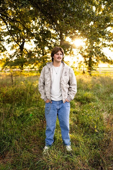 Twin senior boys from Warrenton High School standing on a gravel road in High Hill Missouri.
Brothers laughing together during their senior session in a country field.
Twin seniors leaning against a fence with warm evening light behind them.
Warrenton High School seniors walking side by side down a gravel path.
Close–up of the twins smiling during their High Hill Missouri session.