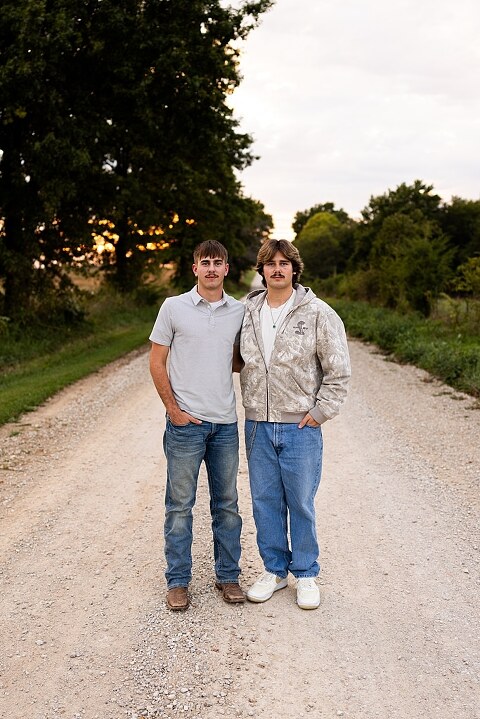 Twin senior boys from Warrenton High School standing on a gravel road in High Hill Missouri.
Brothers laughing together during their senior session in a country field.
Twin seniors leaning against a fence with warm evening light behind them.
Warrenton High School seniors walking side by side down a gravel path.
Close–up of the twins smiling during their High Hill Missouri session.