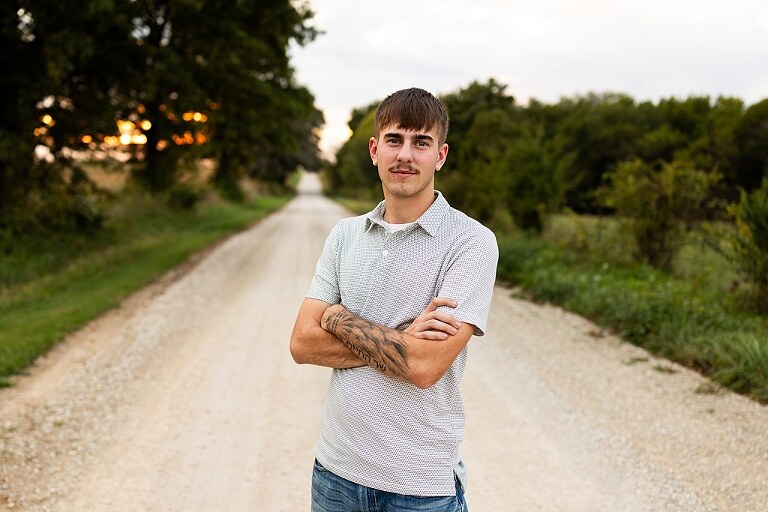Twin senior boys from Warrenton High School standing on a gravel road in High Hill Missouri.
Brothers laughing together during their senior session in a country field.
Twin seniors leaning against a fence with warm evening light behind them.
Warrenton High School seniors walking side by side down a gravel path.
Close–up of the twins smiling during their High Hill Missouri session.
