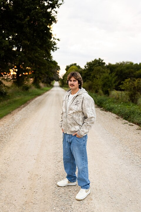 Twin senior boys from Warrenton High School standing on a gravel road in High Hill Missouri.
Brothers laughing together during their senior session in a country field.
Twin seniors leaning against a fence with warm evening light behind them.
Warrenton High School seniors walking side by side down a gravel path.
Close–up of the twins smiling during their High Hill Missouri session.