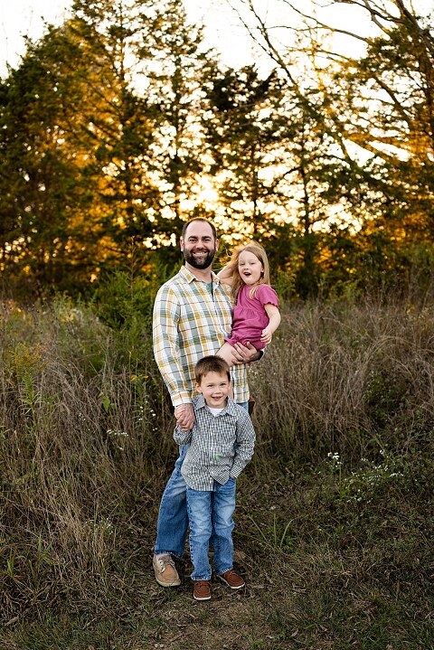 Family standing together at Towne Park during a golden afternoon.
Kids smiling and posing on a gravel path at Towne Park.
Parents laughing while holding their children during the session.
Children running through a sunny field at Towne Park.
Family cuddled together on a grassy patch beneath tall trees.