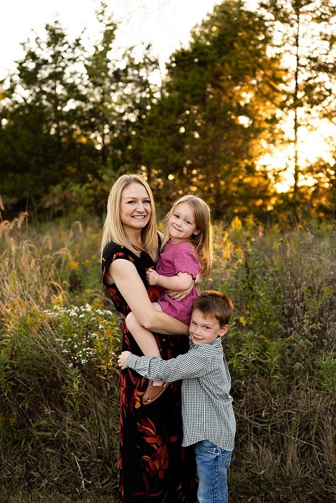Family standing together at Towne Park during a golden afternoon.
Kids smiling and posing on a gravel path at Towne Park.
Parents laughing while holding their children during the session.
Children running through a sunny field at Towne Park.
Family cuddled together on a grassy patch beneath tall trees.