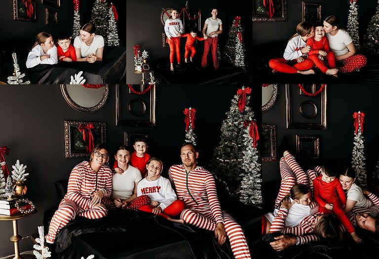 Moody Christmas mini session setup with black bed, snowy Christmas trees, cranberry and popcorn garland, and gold and red holiday accents in a Lake St Louis studio