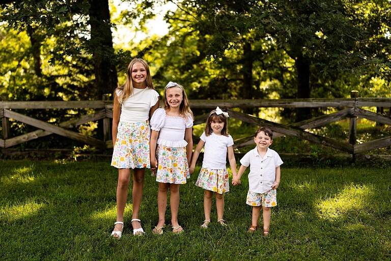Cousins laughing together at Mamoo Cousin Camp summer photos | Kids posing in the same yard spot during Mamoo Cousin Camp | Missouri Photographer Missouri Family Photographer Missouri outdoor photographer